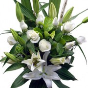 glass vase with classical roses and white oriental lilies